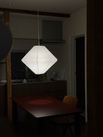 Lower Suite: a paper lantern over the dining table